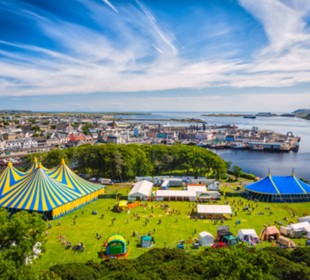 drone looking down on Heb Celt festival site with water and ferry terminal in the background. 