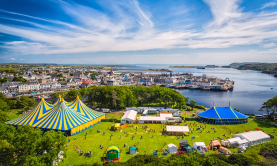drone looking down on Heb Celt festival site with water and ferry terminal in the background. 