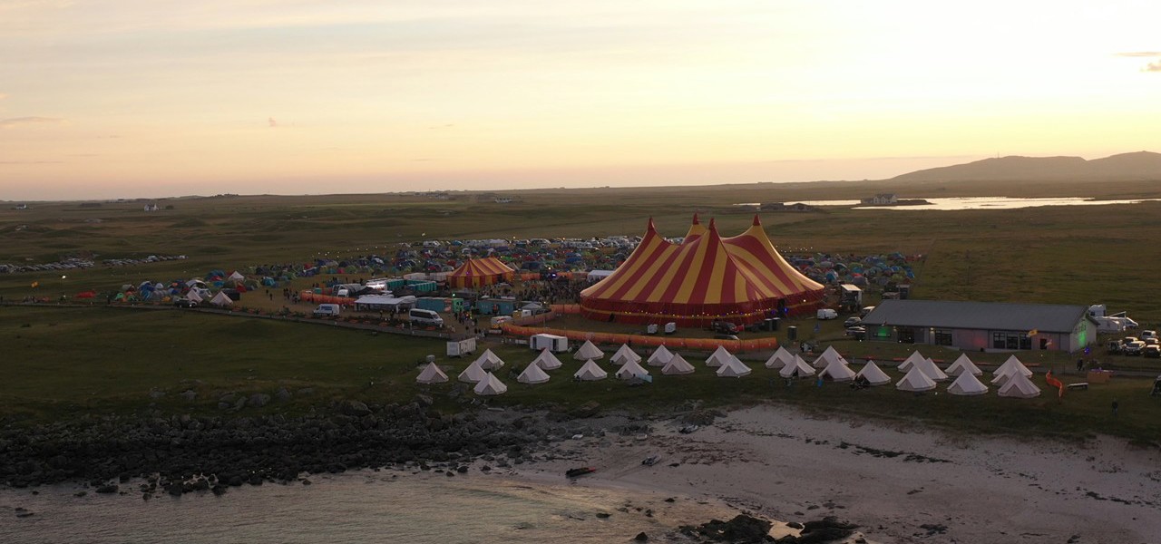 Image over looking the Tiree Music Festival site at sunset