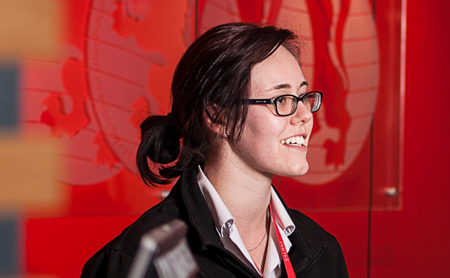 A CalMac staff member welcoming a customer