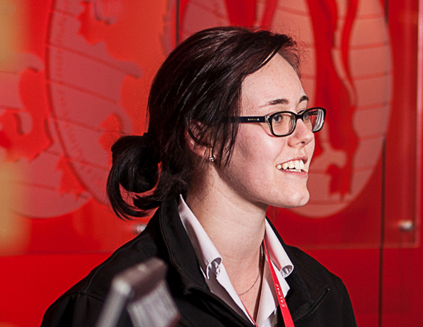 A CalMac staff member welcoming a customer