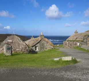 A Blackhouse village of old stone made, thatched roof crofting homes, Lewis.