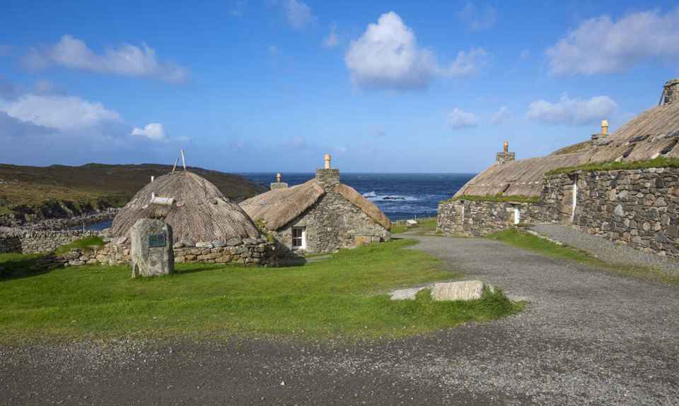 A Blackhouse village of old stone made, thatched roof crofting homes, Lewis.