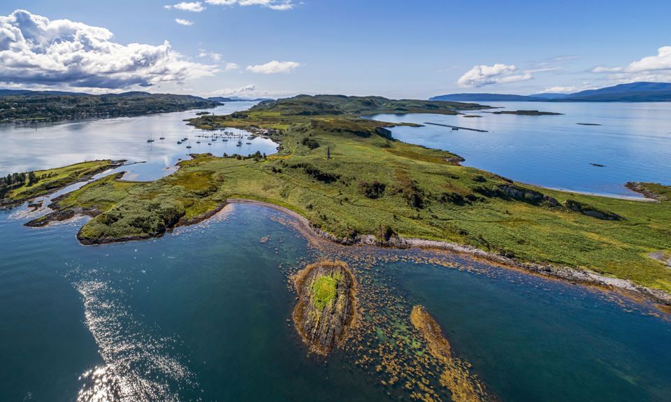 An aerial view of the isle of Kerrera including the Hutcheson monument and the Marina