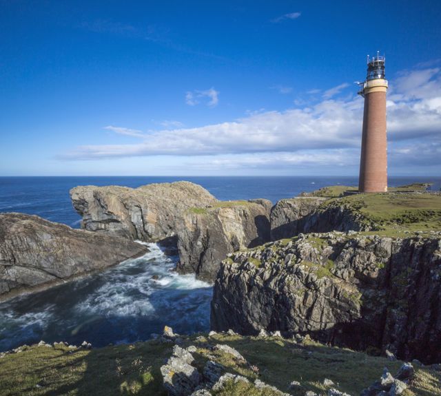 The rocky coastline with Butt of Lewis Lighthouse, Lewis.