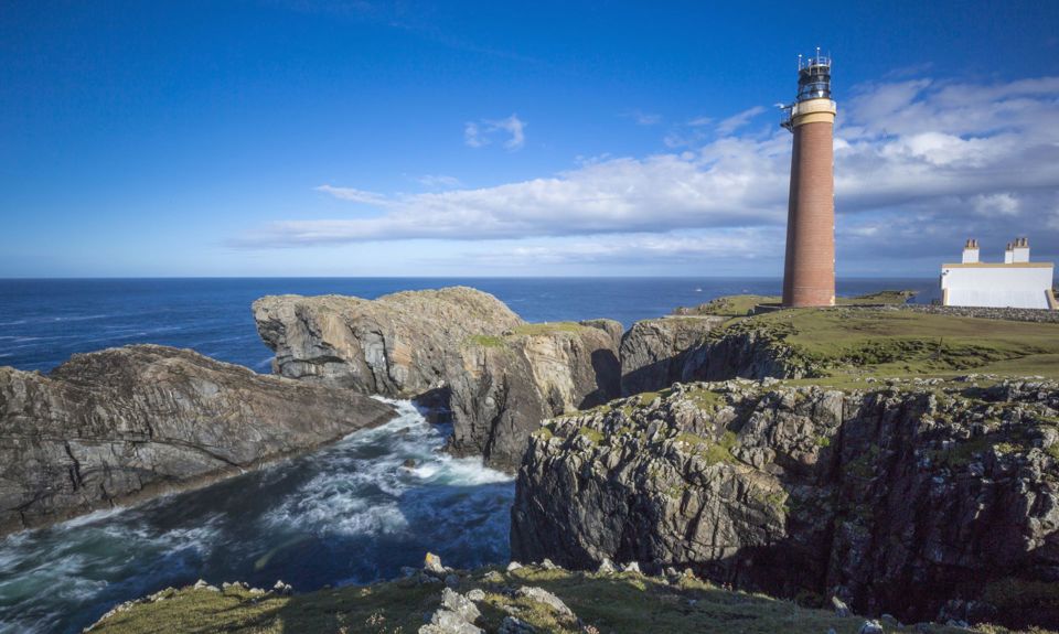 The rocky coastline with Butt of Lewis Lighthouse, Lewis.