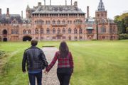 A couple walking up to Mount Stuart House