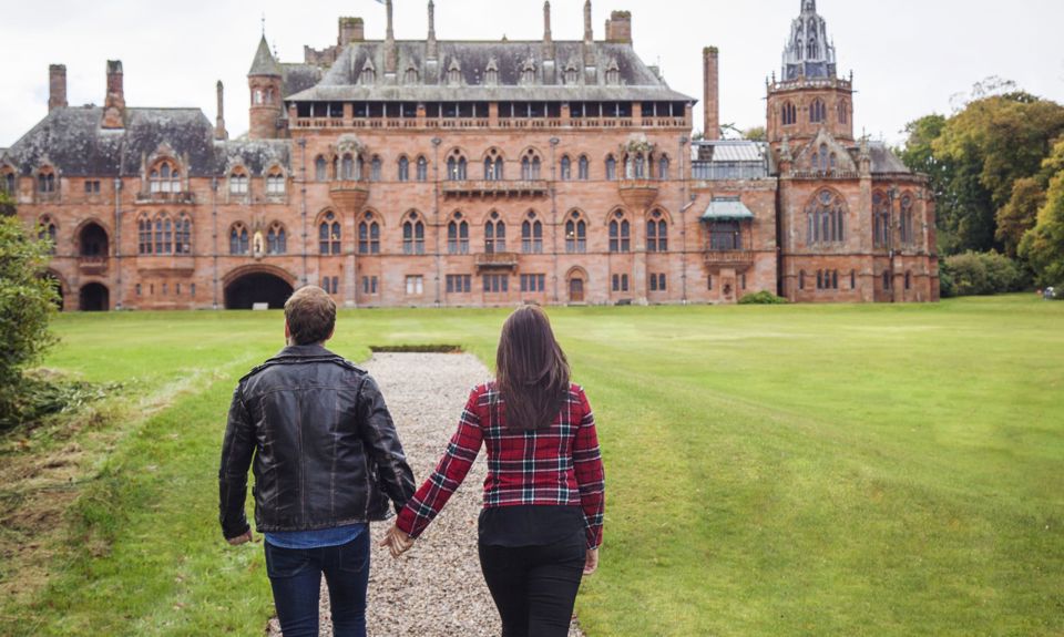 A couple walking up to Mount Stuart House