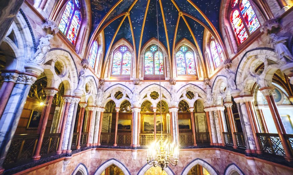 The arches and stained glass windows inside Mount Stuart 