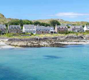 Iona shoreline with the the houses of Iona village in the background.