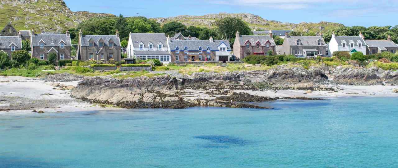 Iona shoreline with the the houses of Iona village in the background.