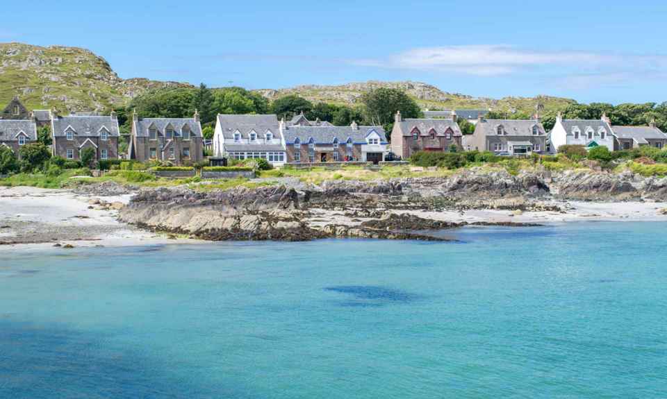 Iona shoreline with the the houses of Iona village in the background.