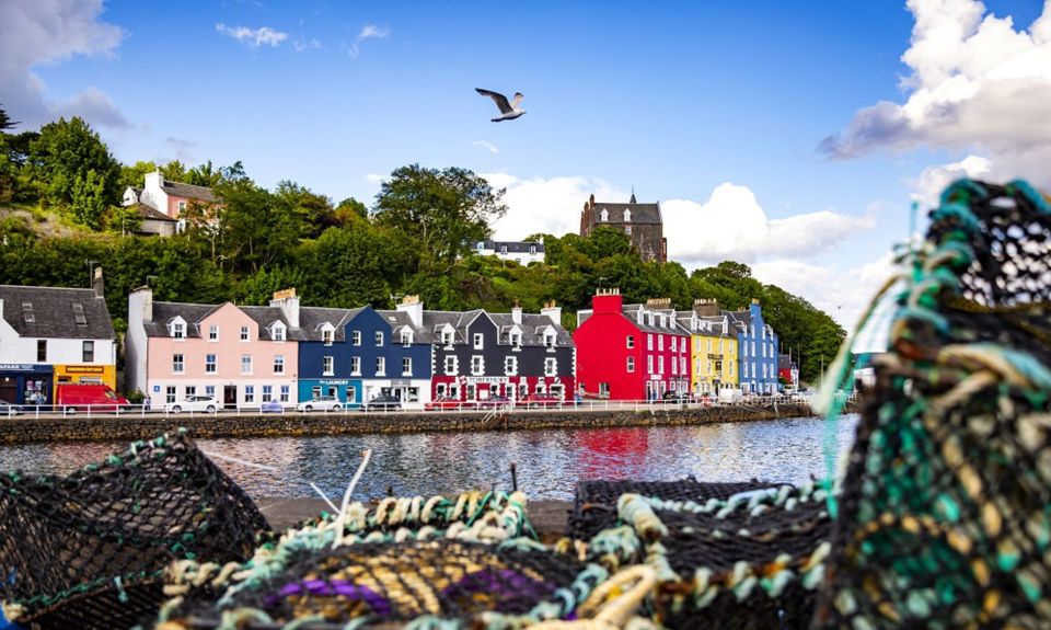 The colourful houses at Tobermory harbour on the Isle of Mull, with fishermens creels in the foreground.
