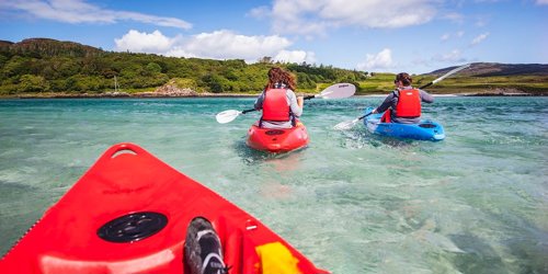 Kayakers paddling to the shore