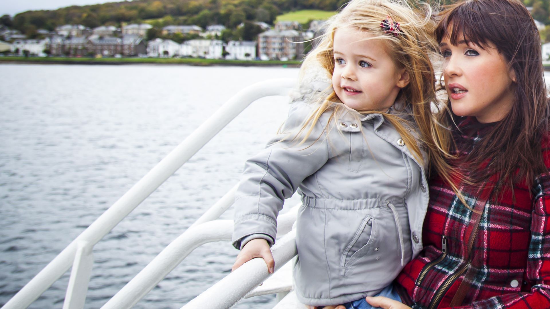 A mother and daughter enjoying a trip outside on the CalMac ferry to Bute.