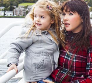 A mother and daughter enjoying a trip outside on the CalMac ferry to Bute.