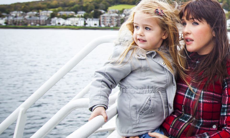 A mother and daughter enjoying a trip outside on the CalMac ferry to Bute.