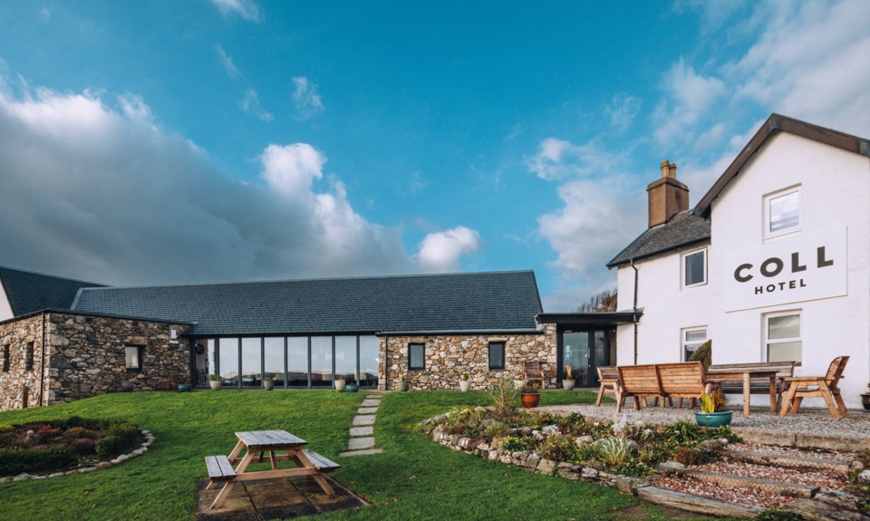 outside of the Coll Hotel with picnic tables on the grass