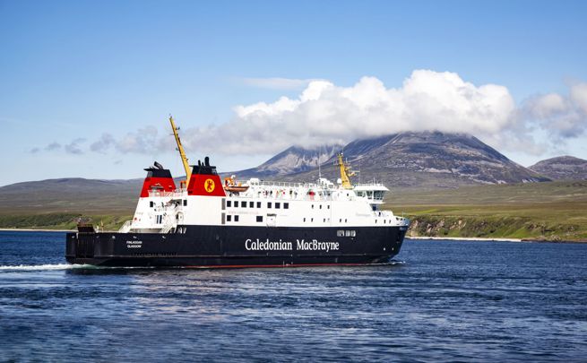 Caledonian MacBrayne ferry to and from Islay called MV Finlaggan, sailing with the cloud covered "Paps of Jura" in the background.