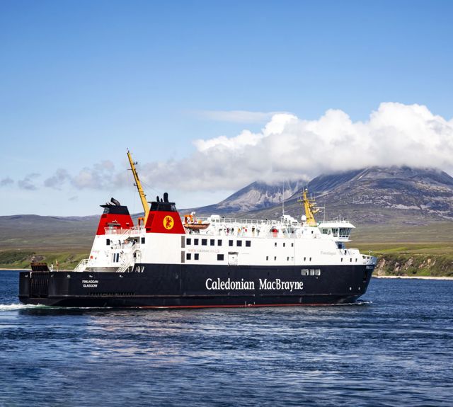 Caledonian MacBrayne ferry to and from Islay called MV Finlaggan, sailing with the cloud covered "Paps of Jura" in the background.