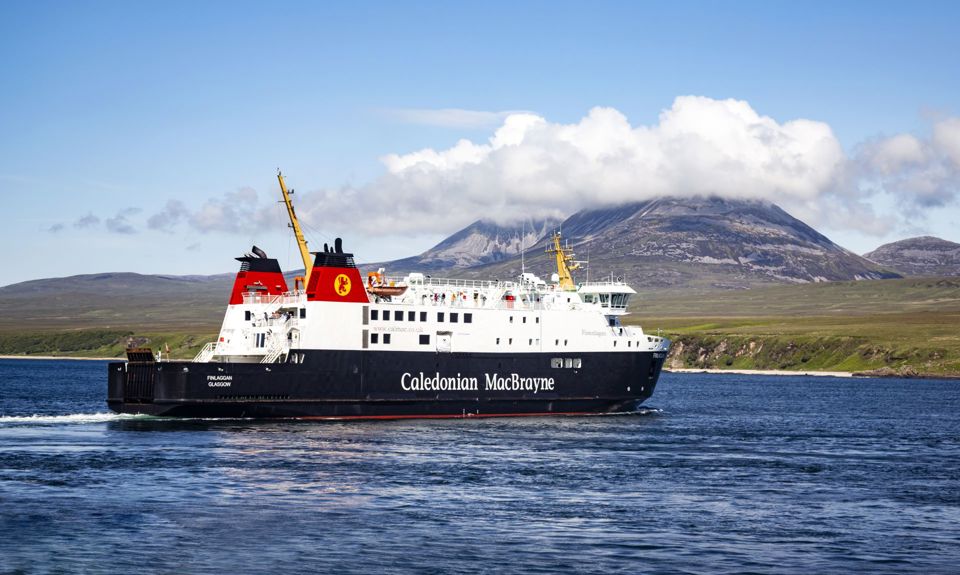 Caledonian MacBrayne ferry to and from Islay called MV Finlaggan, sailing with the cloud covered "Paps of Jura" in the background.