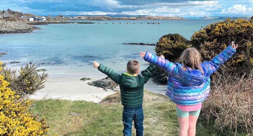 Children playing at a beach on Gigha