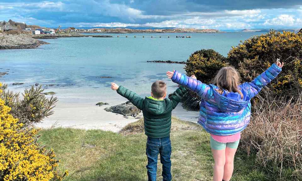 Children playing at a beach on Gigha