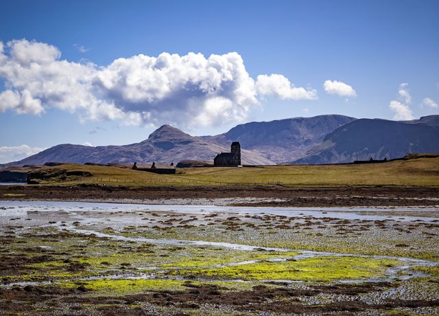 Buildings on Canna with hills behind.