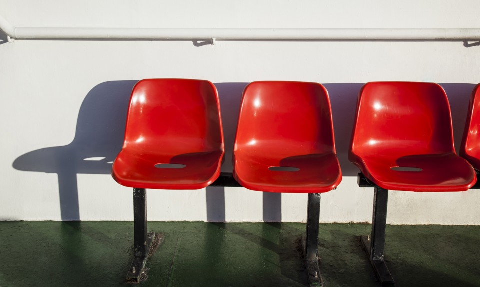 three red chairs out on deck