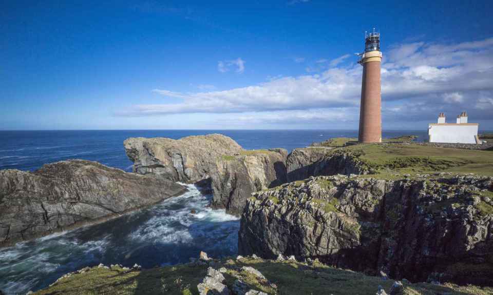 The rocky coastline with Ness Point Lighthouse, Lewis.
