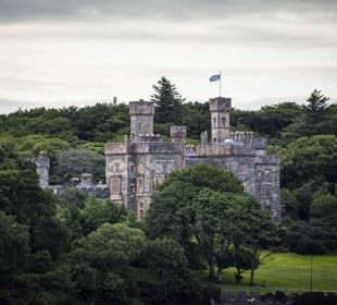 The turreted Lews Castle sits proudly in woodlands, Lewis.