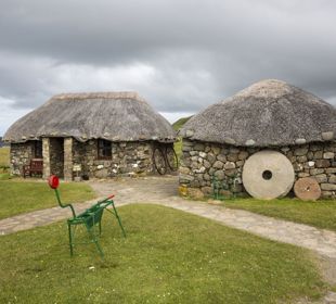 Stone cottages with thatched roofs at the Skye Museum Of Island Life, Skye.