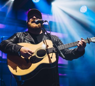 Cammy Barnes performing on stage at EDF