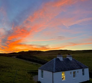 the sunset on a white Cottage, Isle of Colonsay 