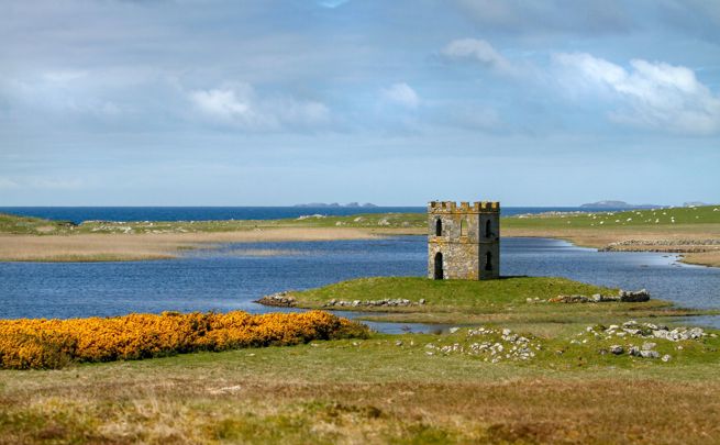 Scolpaig Tower sitting on an small island in a loch, North Uist.