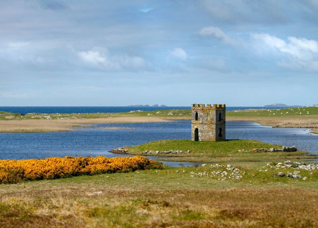 Scolpaig Tower sitting on an small island in a loch, North Uist.