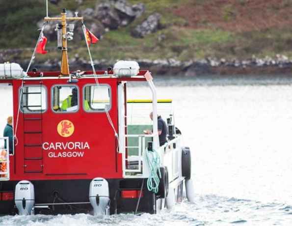 The small ferry MV Carvoria sails across to the Isle of Kerrera