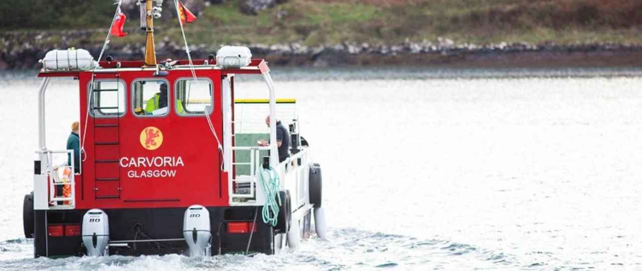 The small ferry MV Carvoria sails across to the Isle of Kerrera