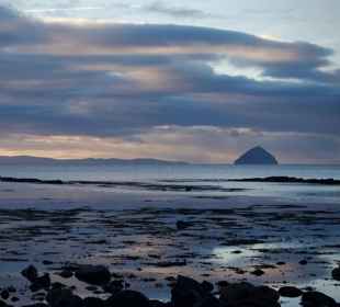 View from Arran of Ailsa Craig and Ayrshire coast at sunrise.