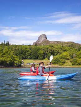 Kayaking with Eigg in the background