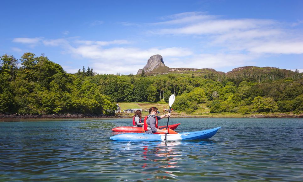 Kayaking with Eigg in the background