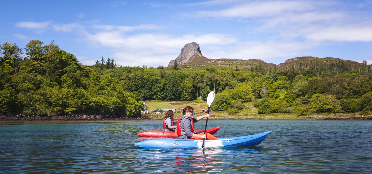 Kayaking with Eigg in the background