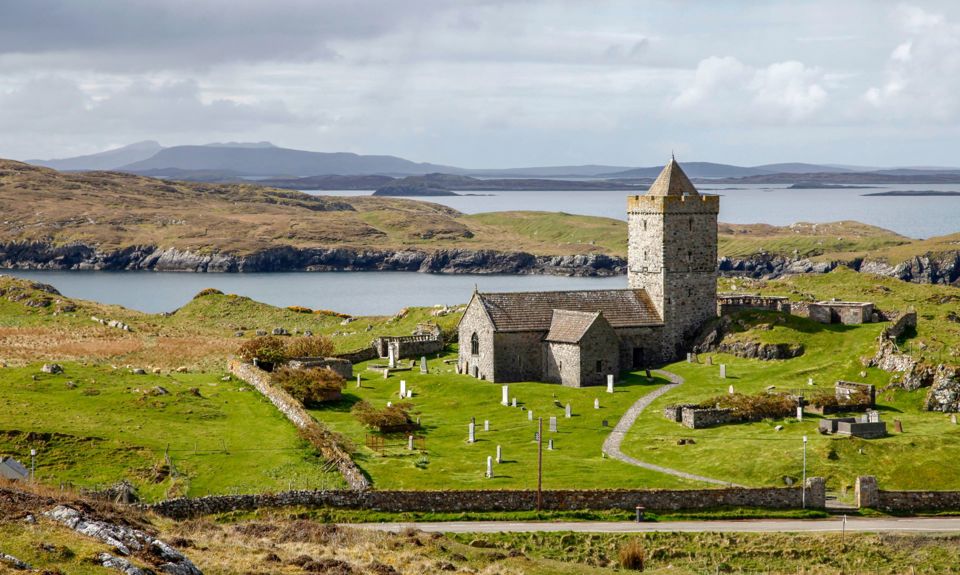 St Clements church building sitting just off a road