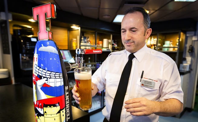 staff pouring a pint of lager