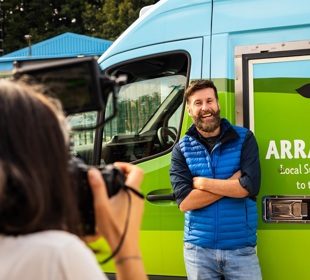 Hebridean Baker standing infront of an Arran Dairies van