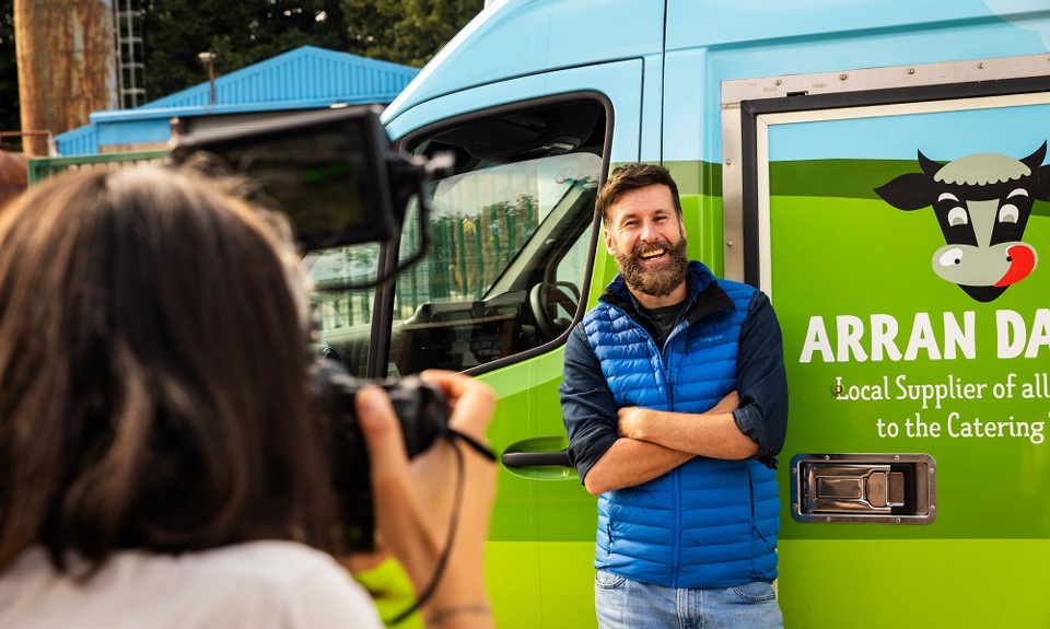 Hebridean Baker standing infront of an Arran Dairies van